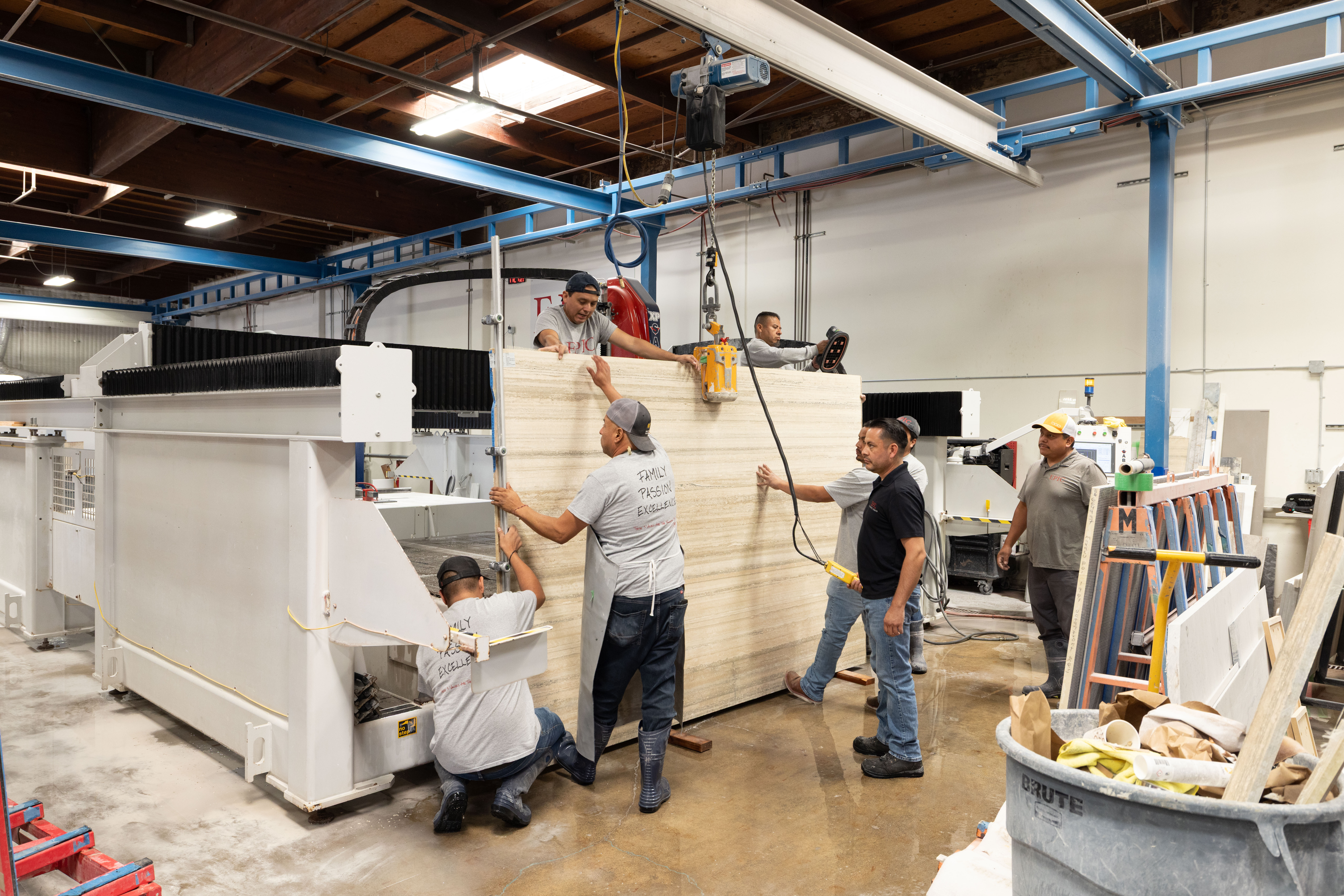 Epic Ceramic & Stone team installing a large-format stone slab for a luxury Orange County residential project.