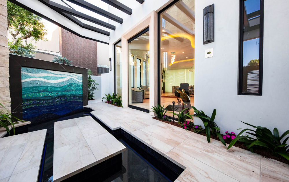 Luxury outdoor pool deck with large-format porcelain tile at a Southern California residence.