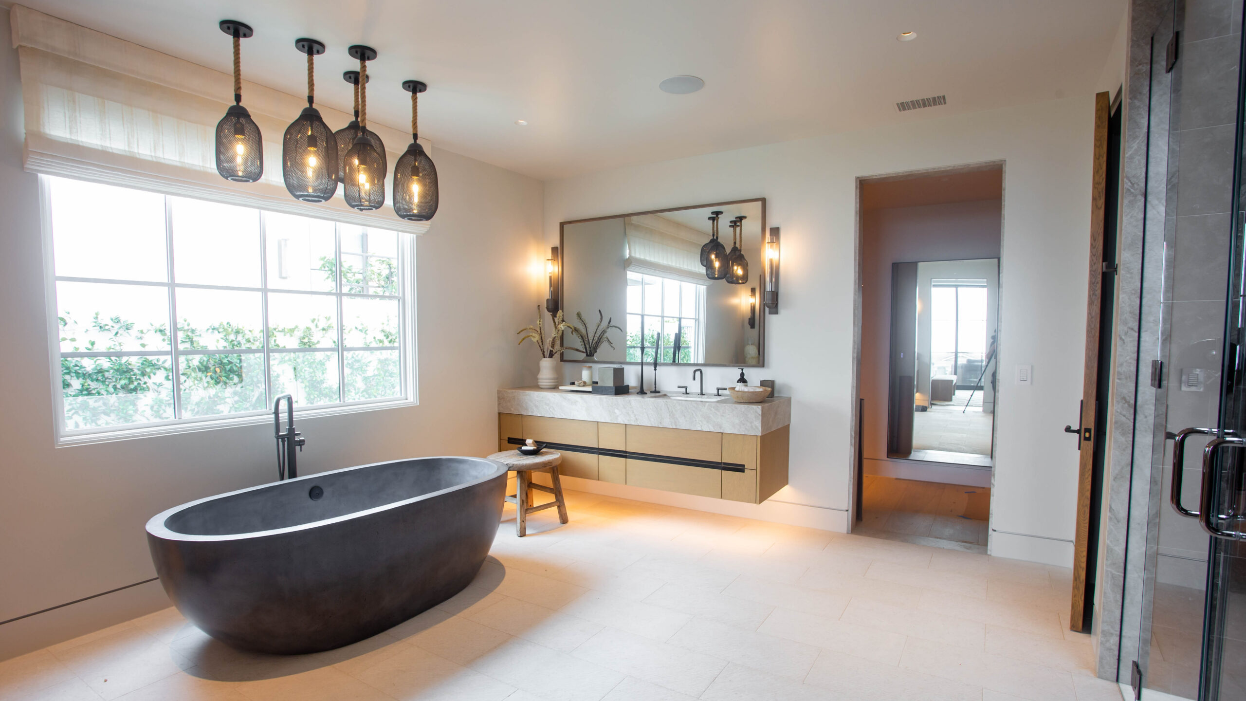 Luxury primary bathroom with custom natural stone installation by Epic Ceramic & Stone in Orange County.