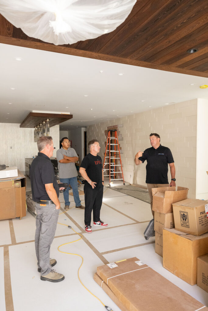 Epic Ceramic & Stone team planning a luxury natural stone installation project in Orange County.