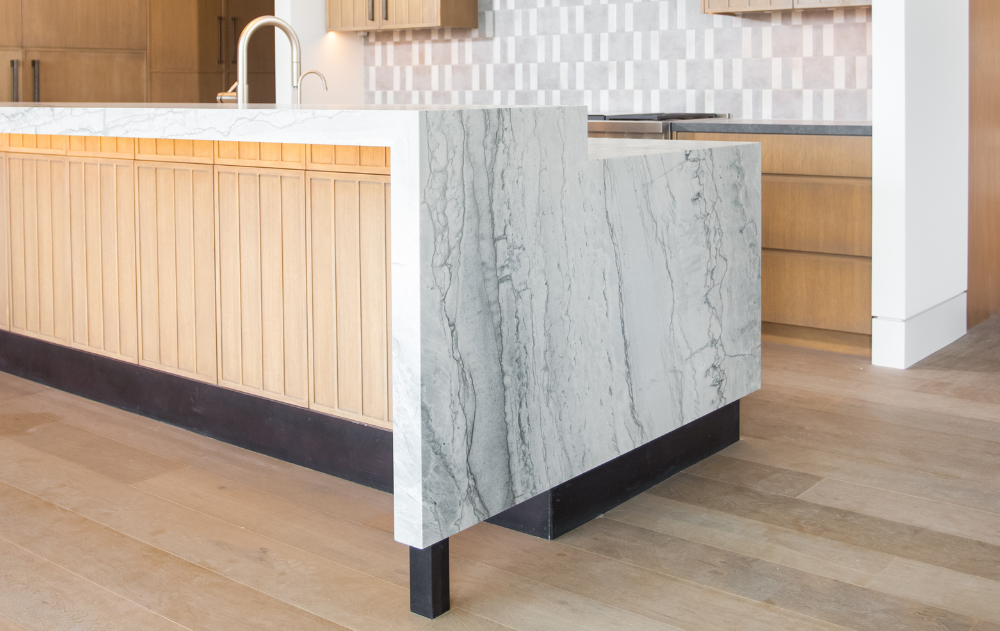 Leathered quartzite kitchen countertop detail showcasing the textured natural stone finish in a luxury Orange County home.